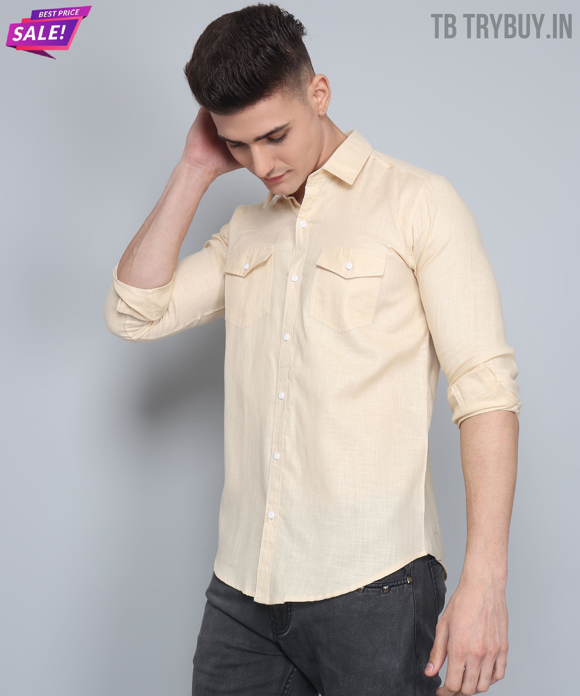 a man in a beige shirt is holding his head