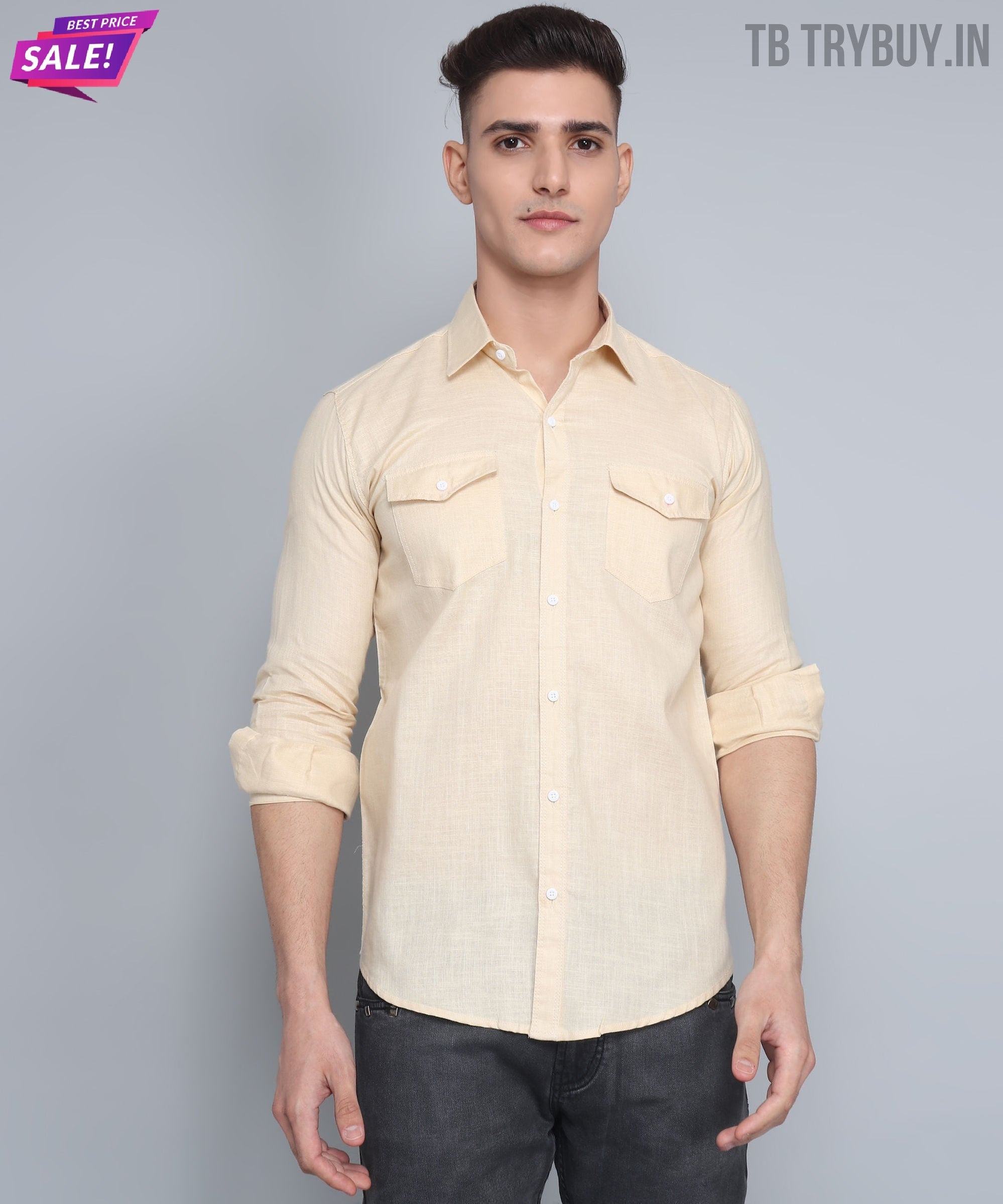 a man in a beige shirt is posing for a picture