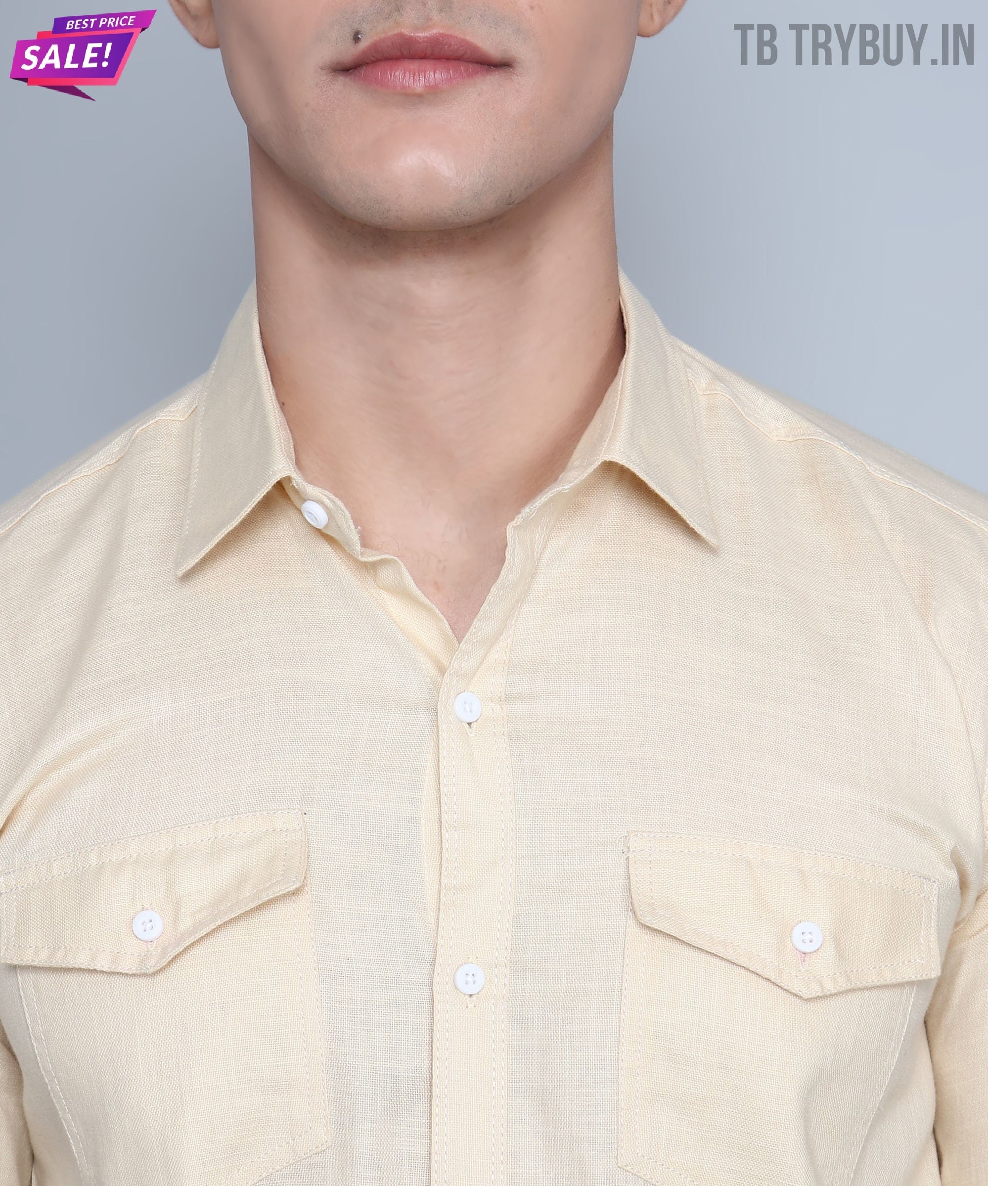 a man in a beige shirt and glasses