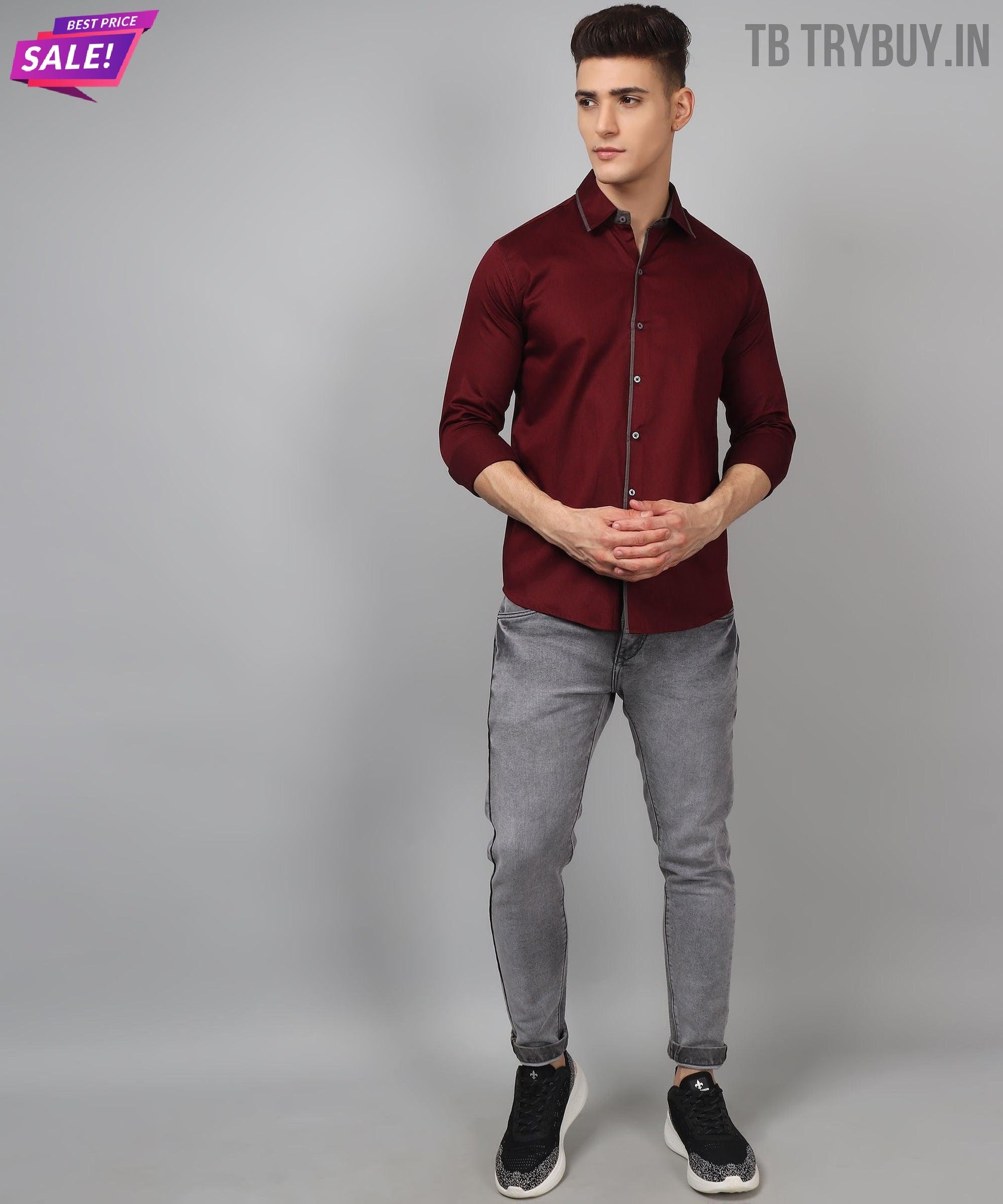 a man in a red shirt and grey pants