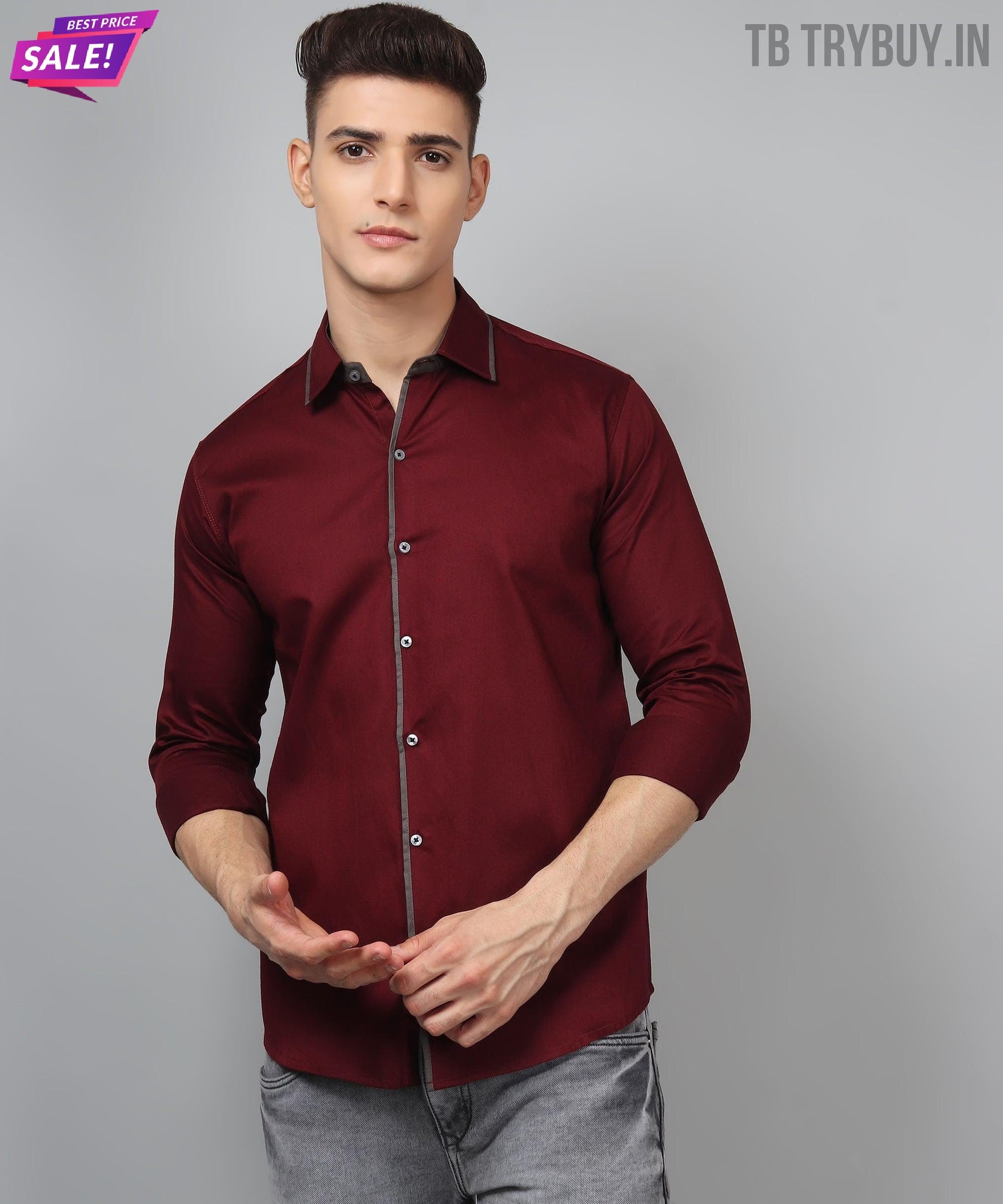 a man wearing a maroon shirt and jeans