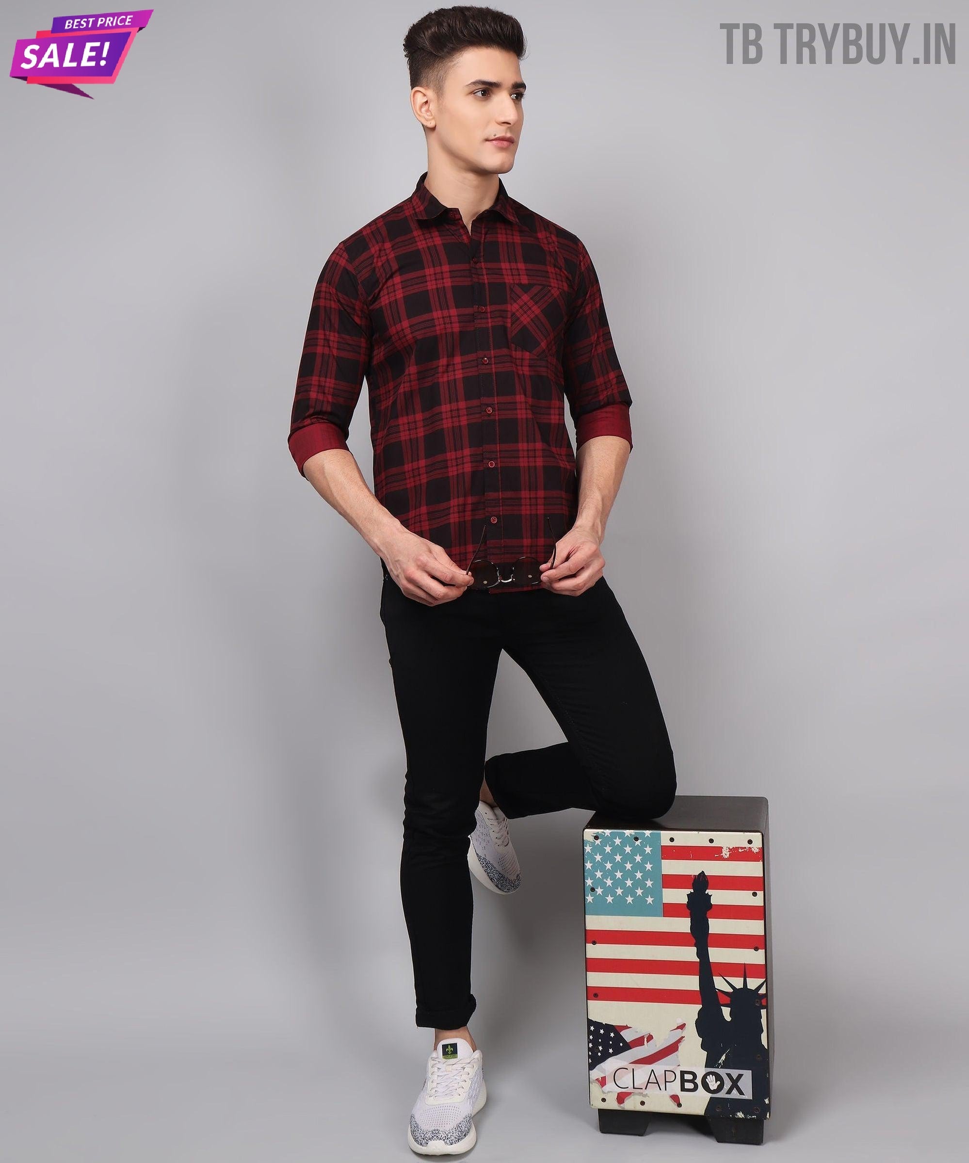 a man standing next to a suitcase with an american flag on it