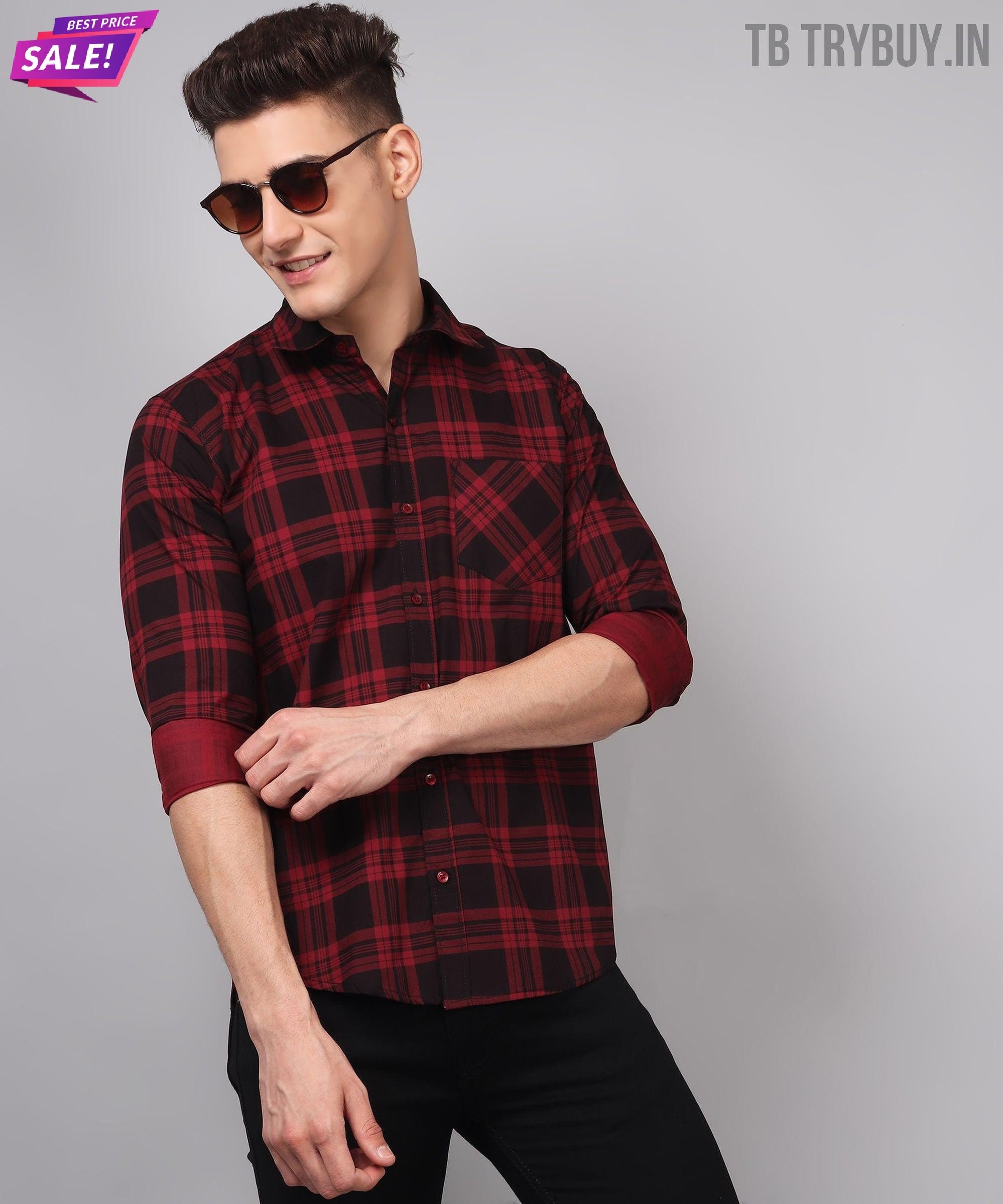 a man wearing a red and black plaid shirt