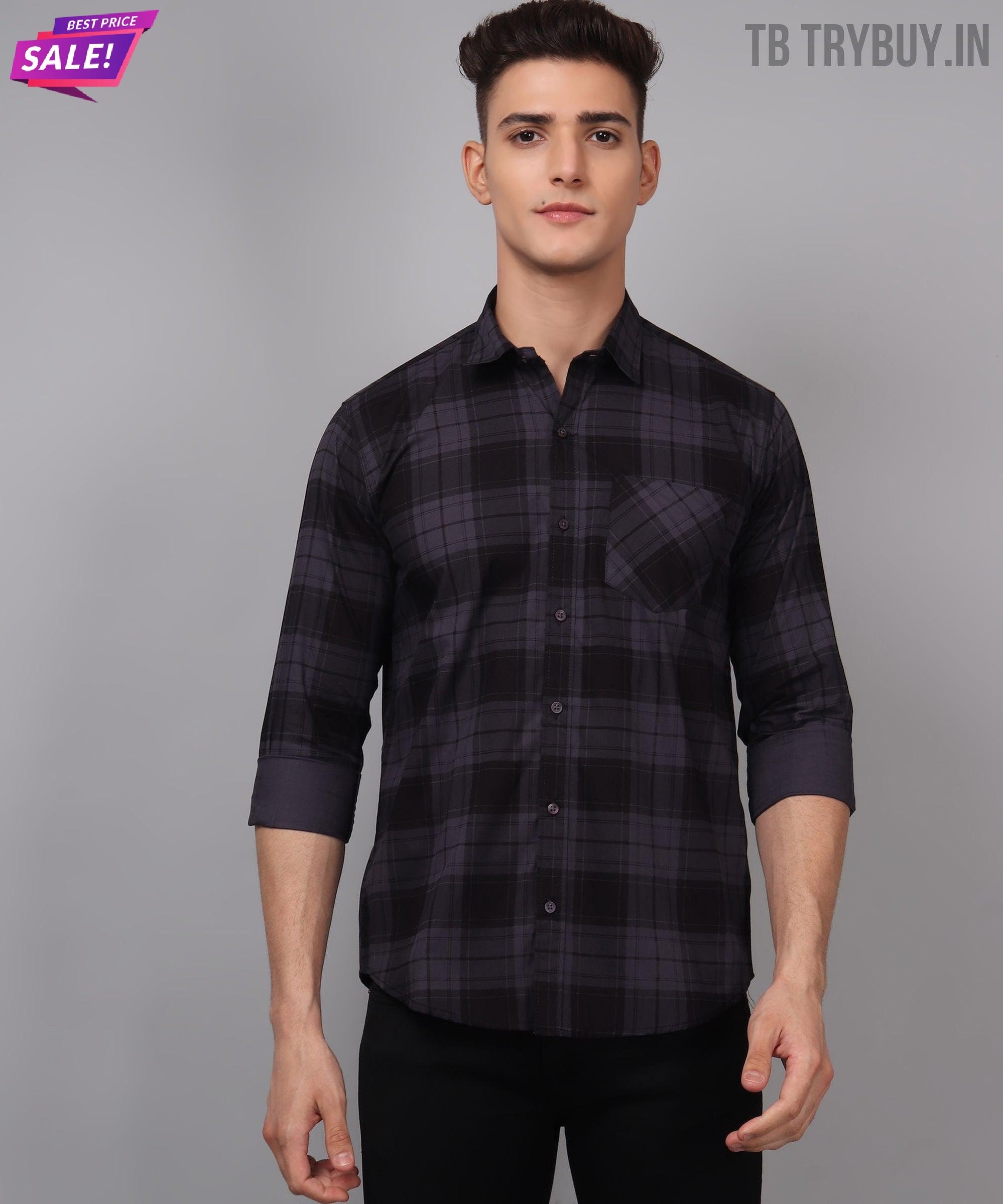 a man wearing a black and grey plaid shirt