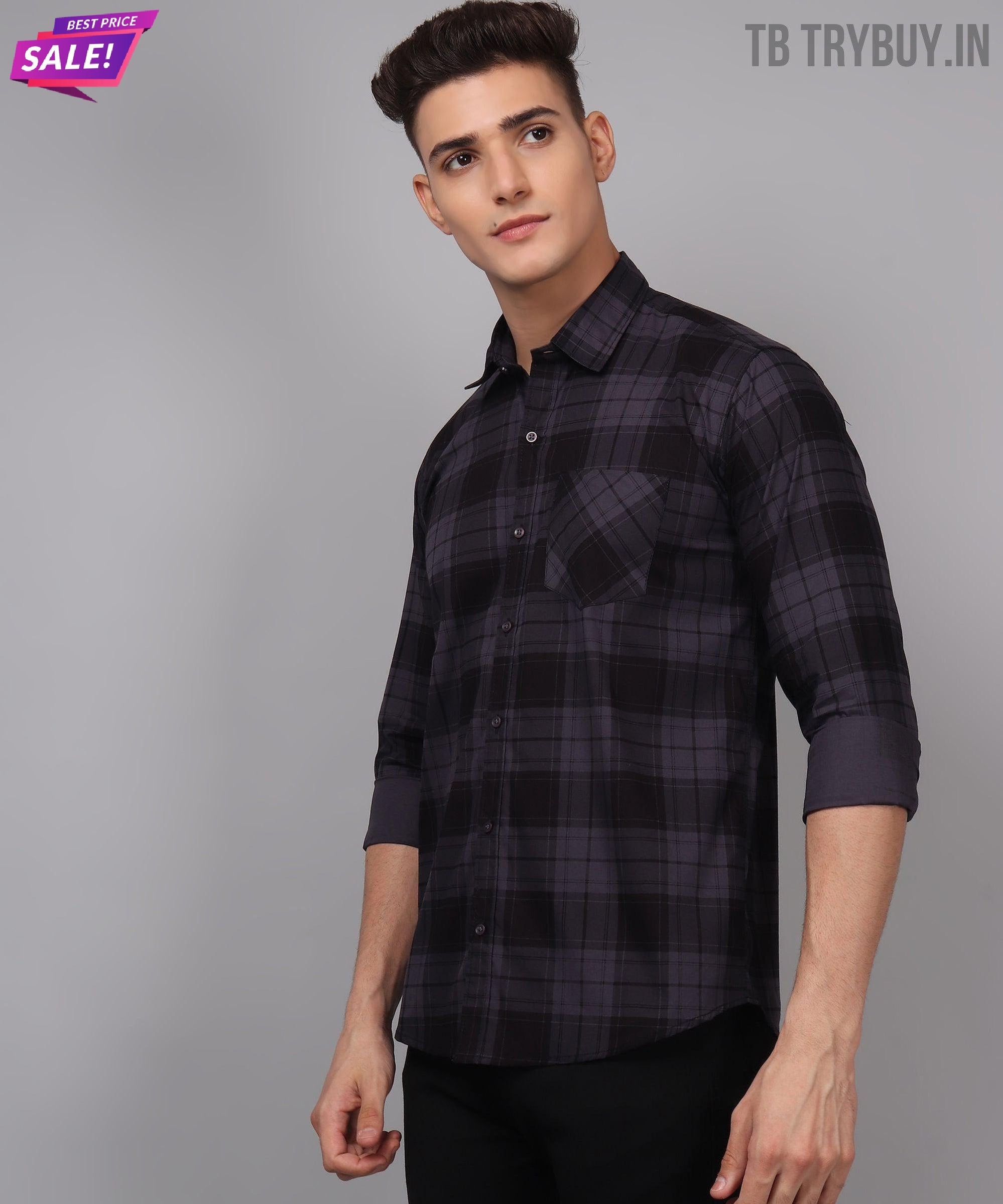 a man wearing a black and grey plaid shirt