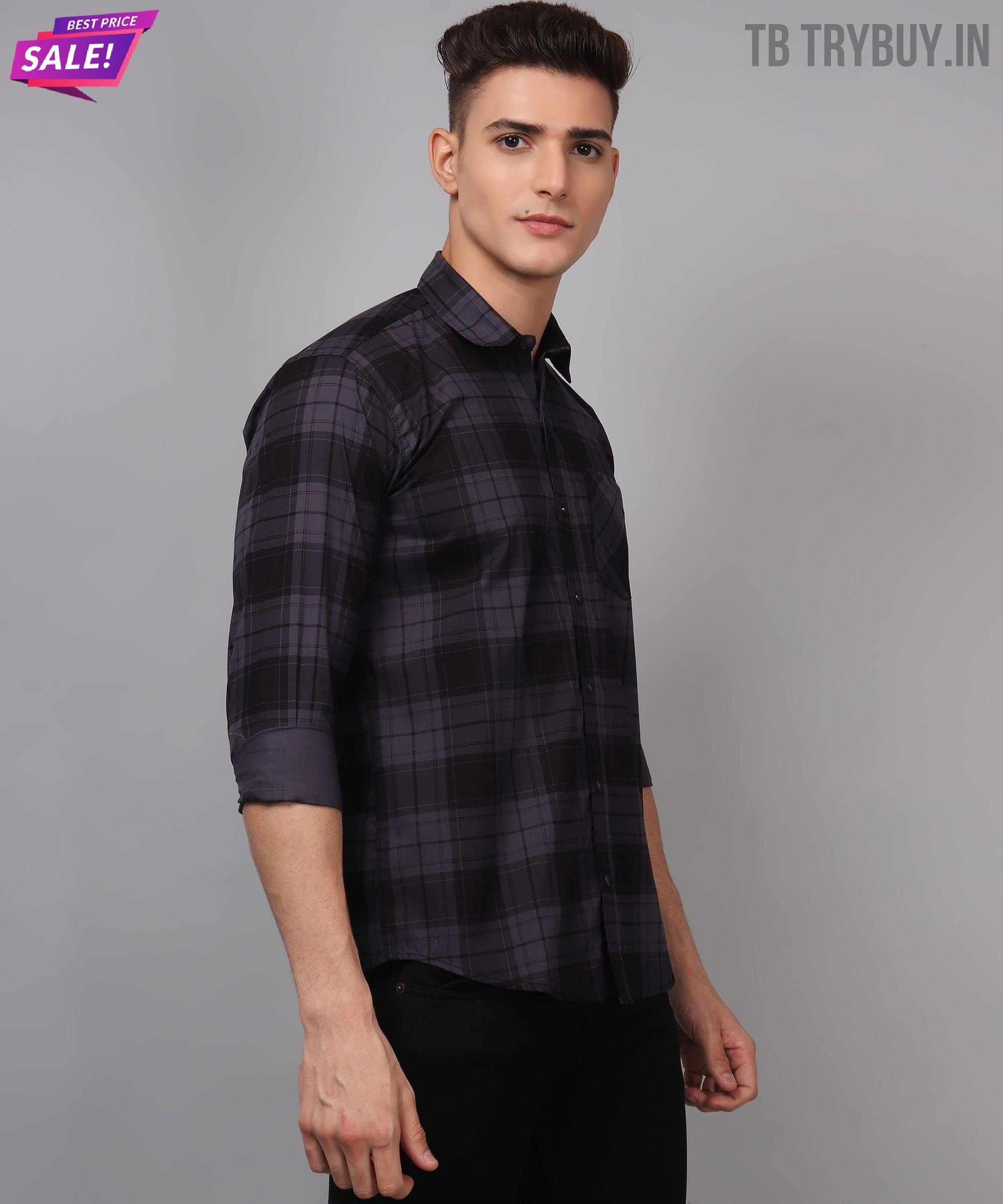 a man wearing a black and grey plaid shirt