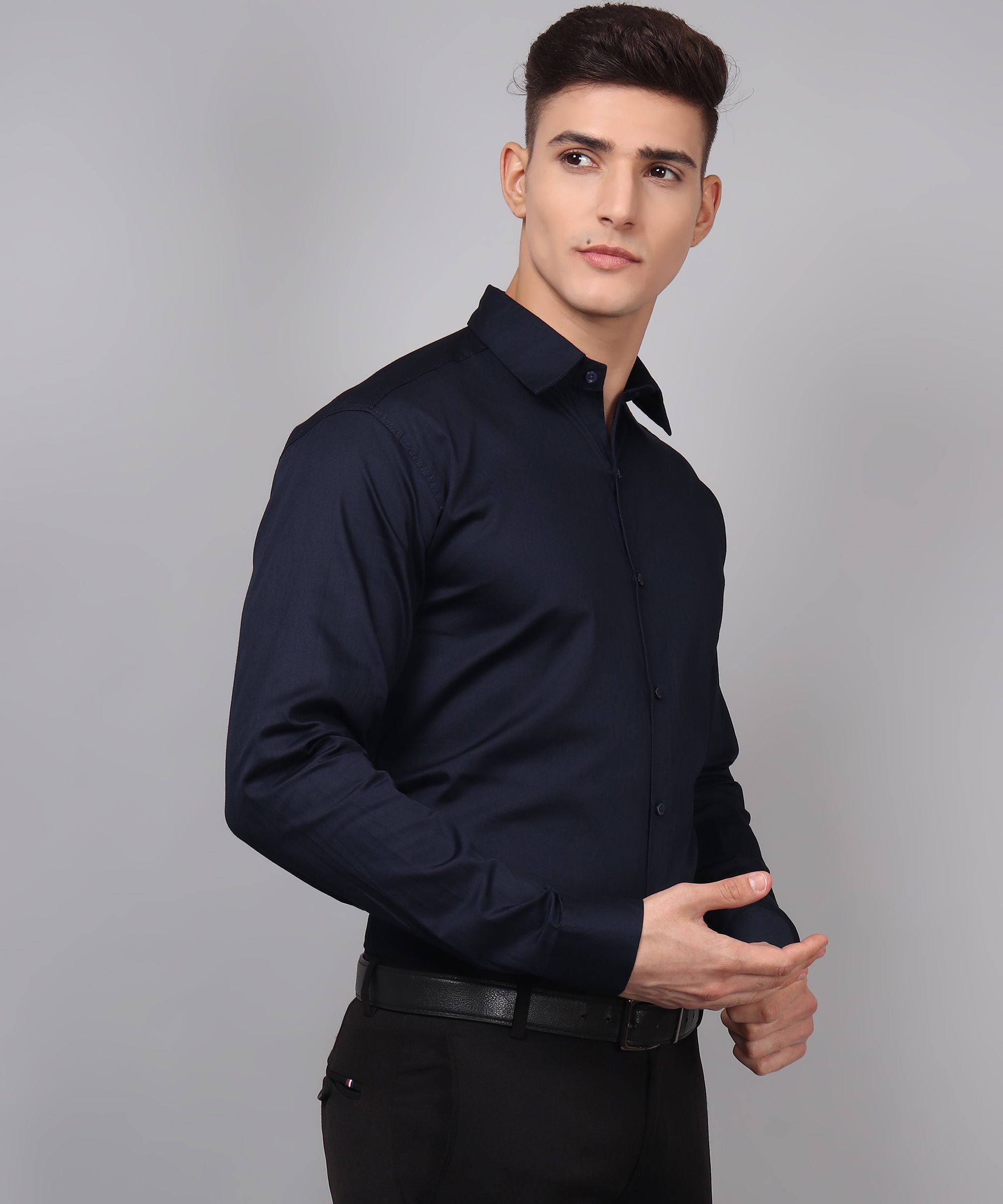a man wearing a black shirt and black pants