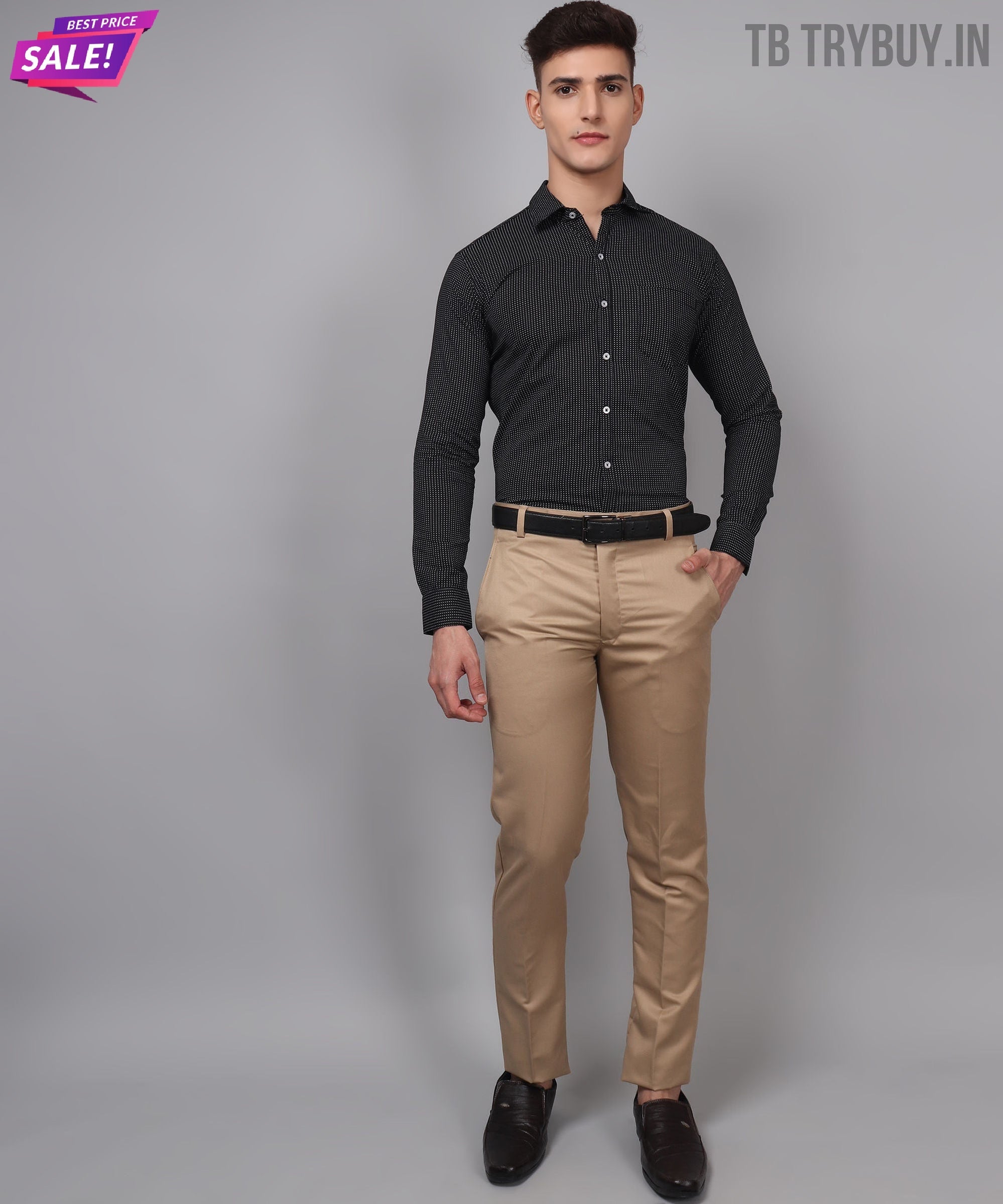 a man in a black shirt and khaki pants