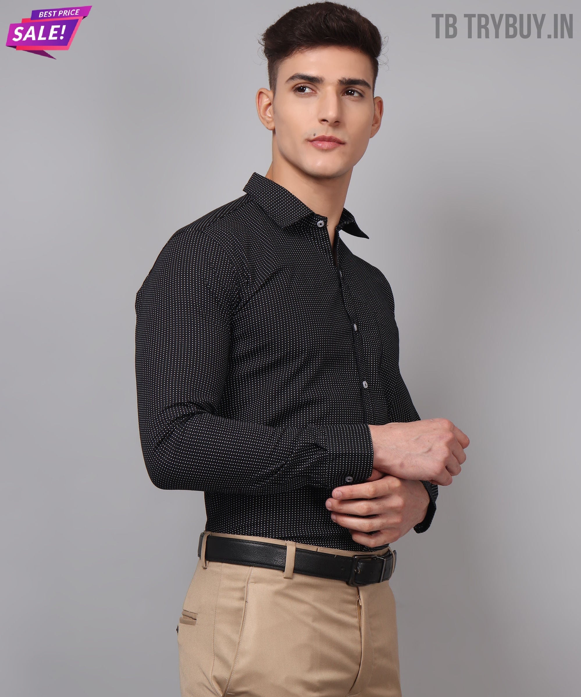 a man wearing a black shirt and tan pants