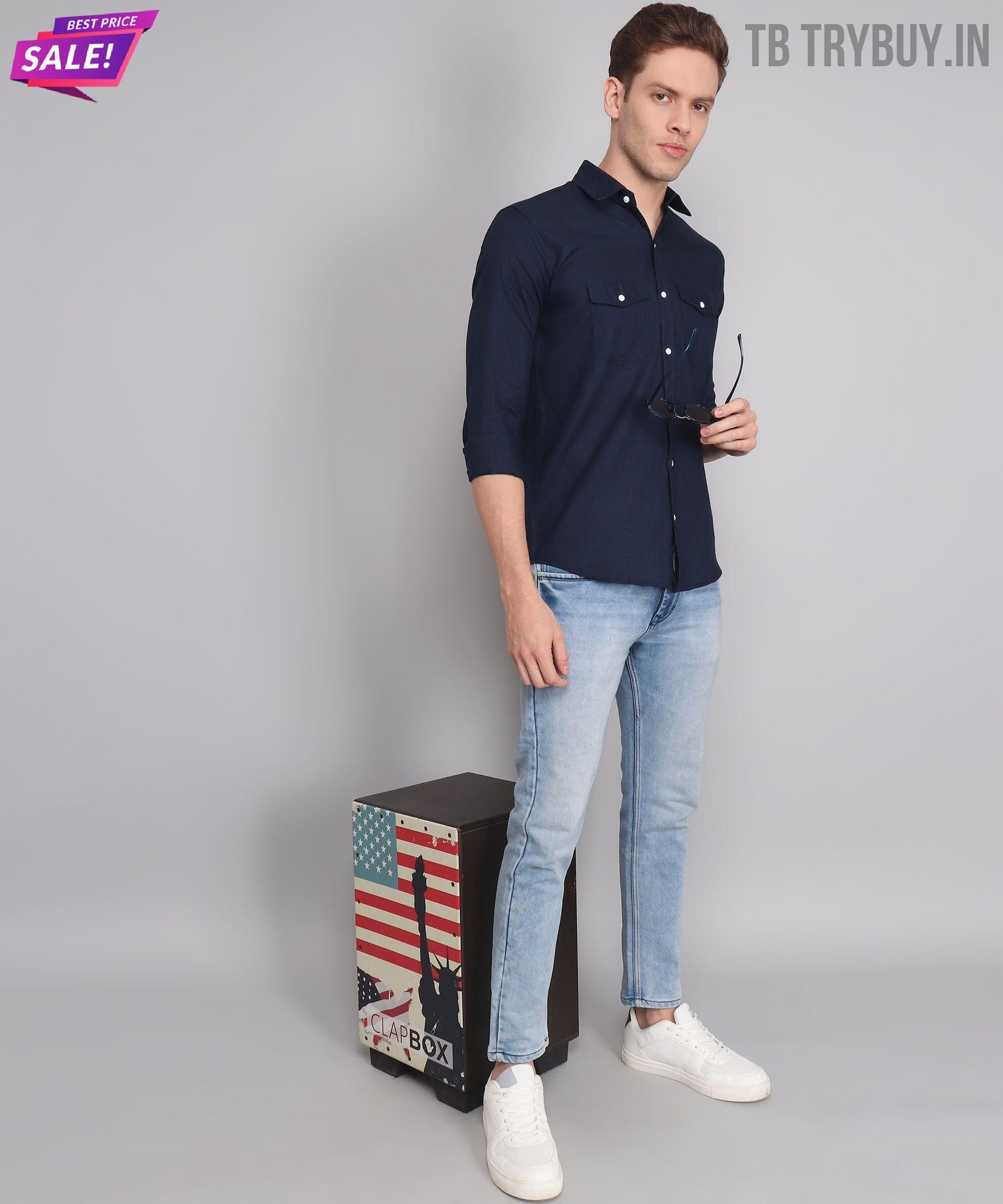 a man standing next to a suitcase with an american flag on it