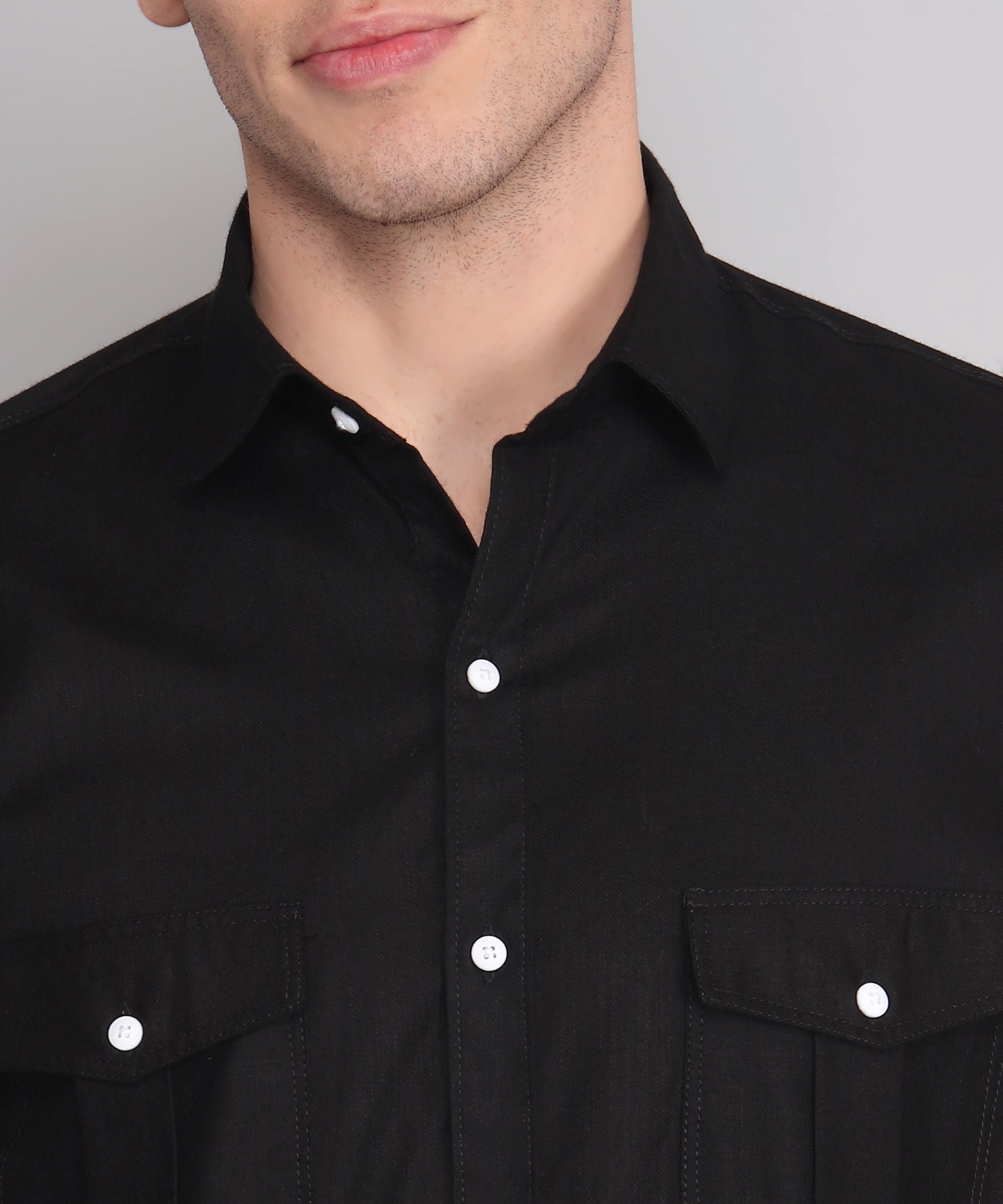 a man wearing a black shirt and glasses