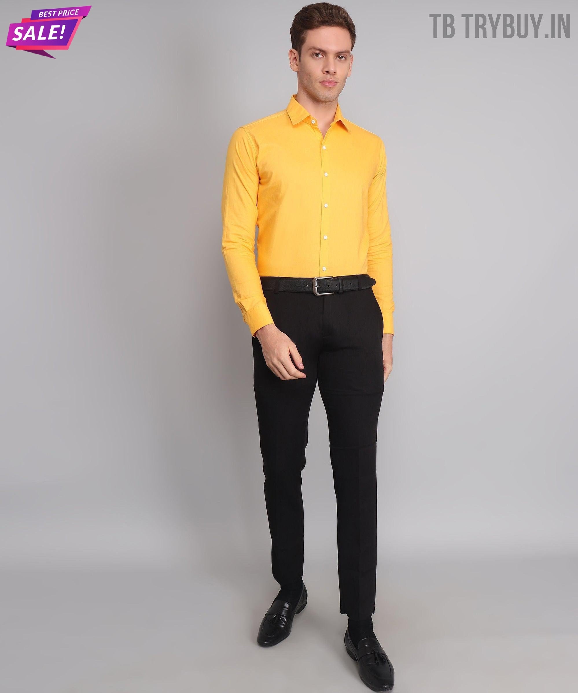 a man in a yellow shirt and black pants