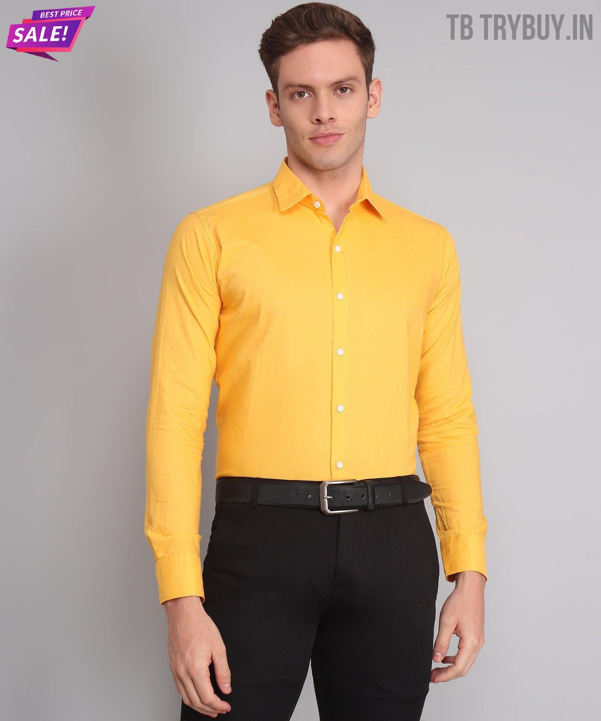 a man wearing a yellow shirt and black pants