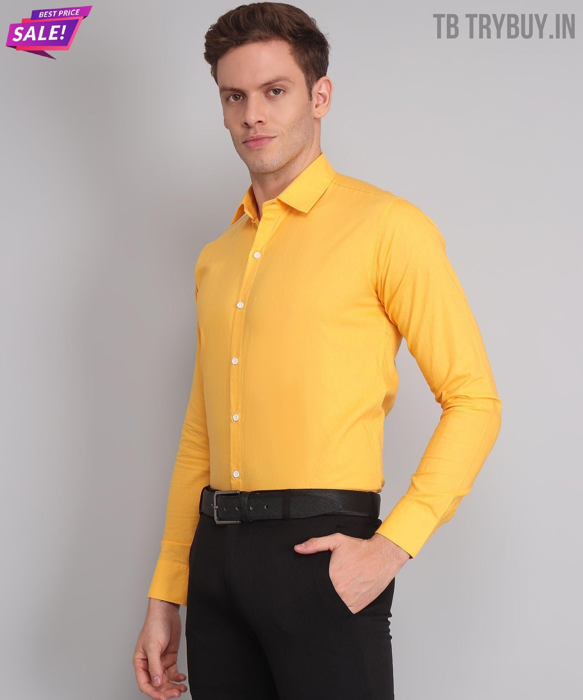 a man wearing a yellow shirt and black pants