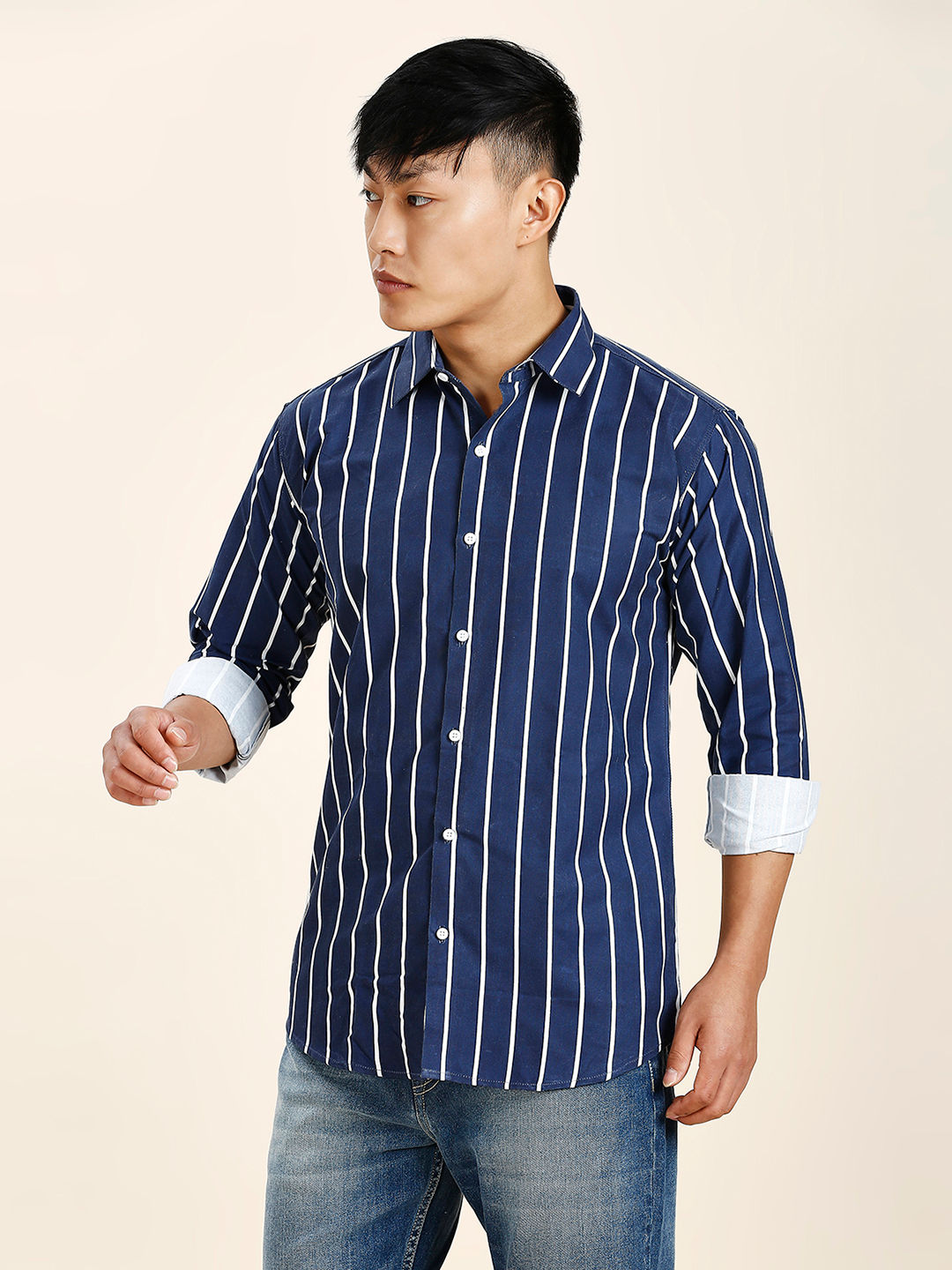 a man in a blue and white striped shirt