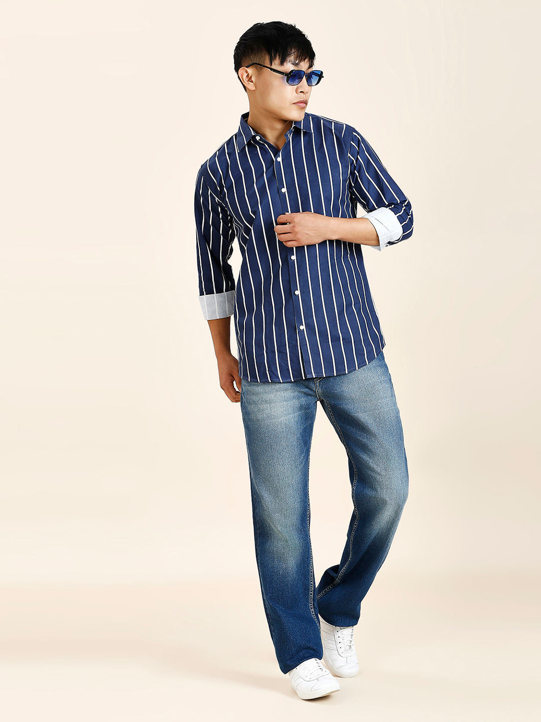 a man in a blue and white striped shirt