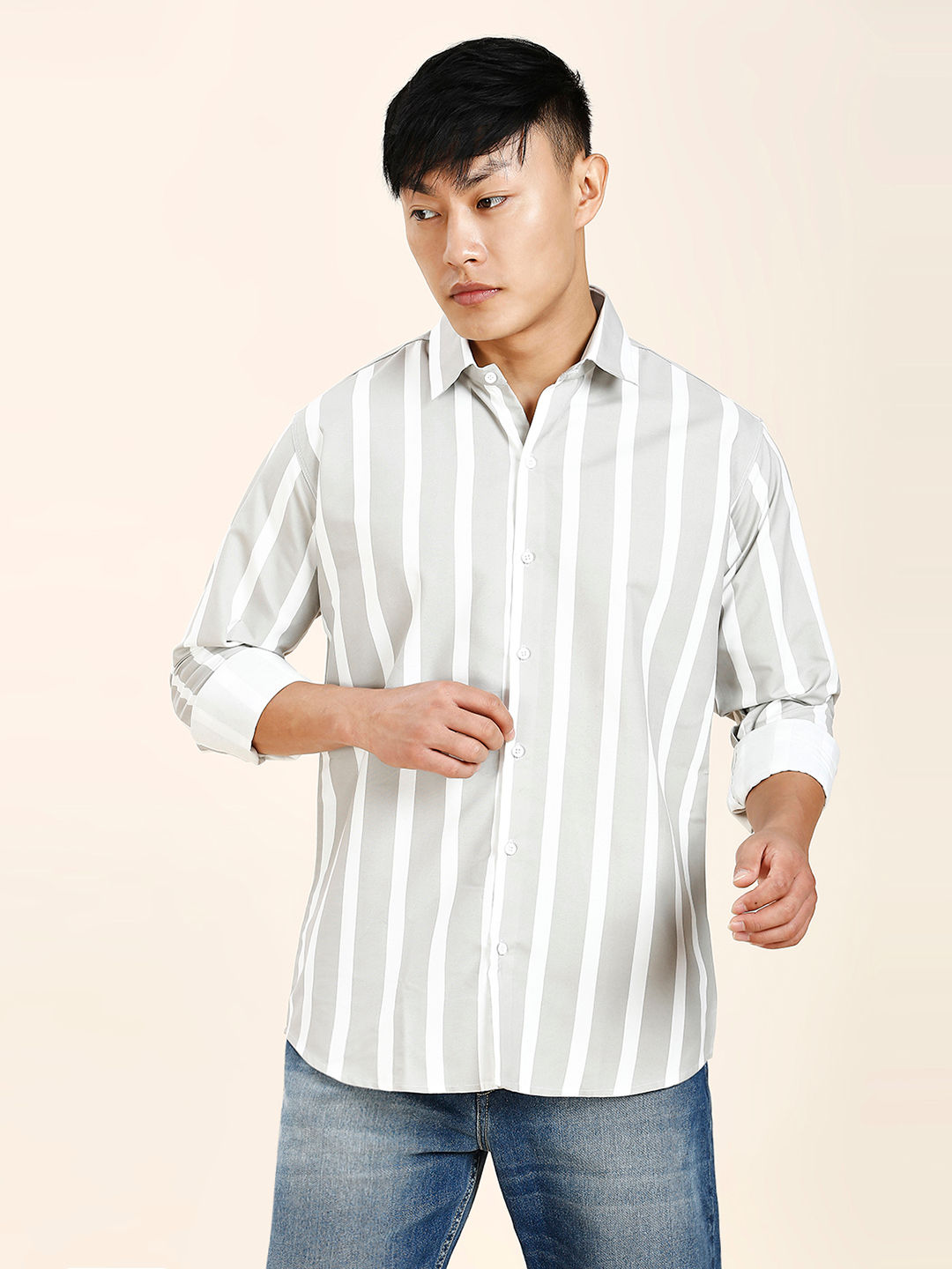 a man in a white and black striped shirt