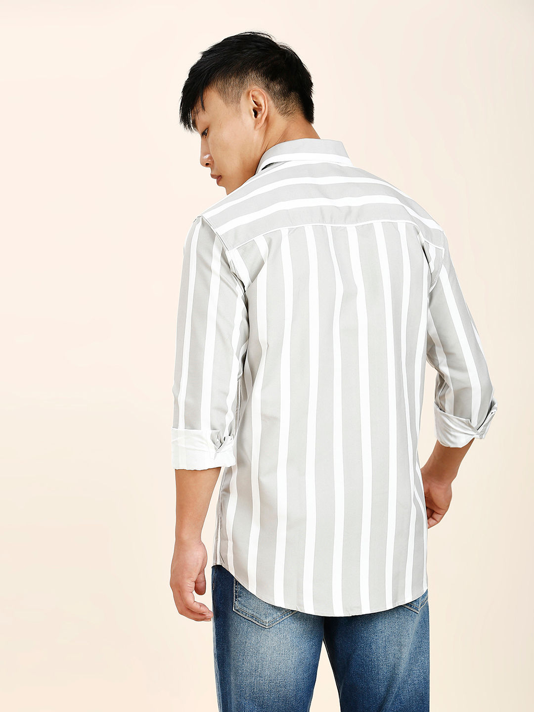 a man in a white and black striped shirt