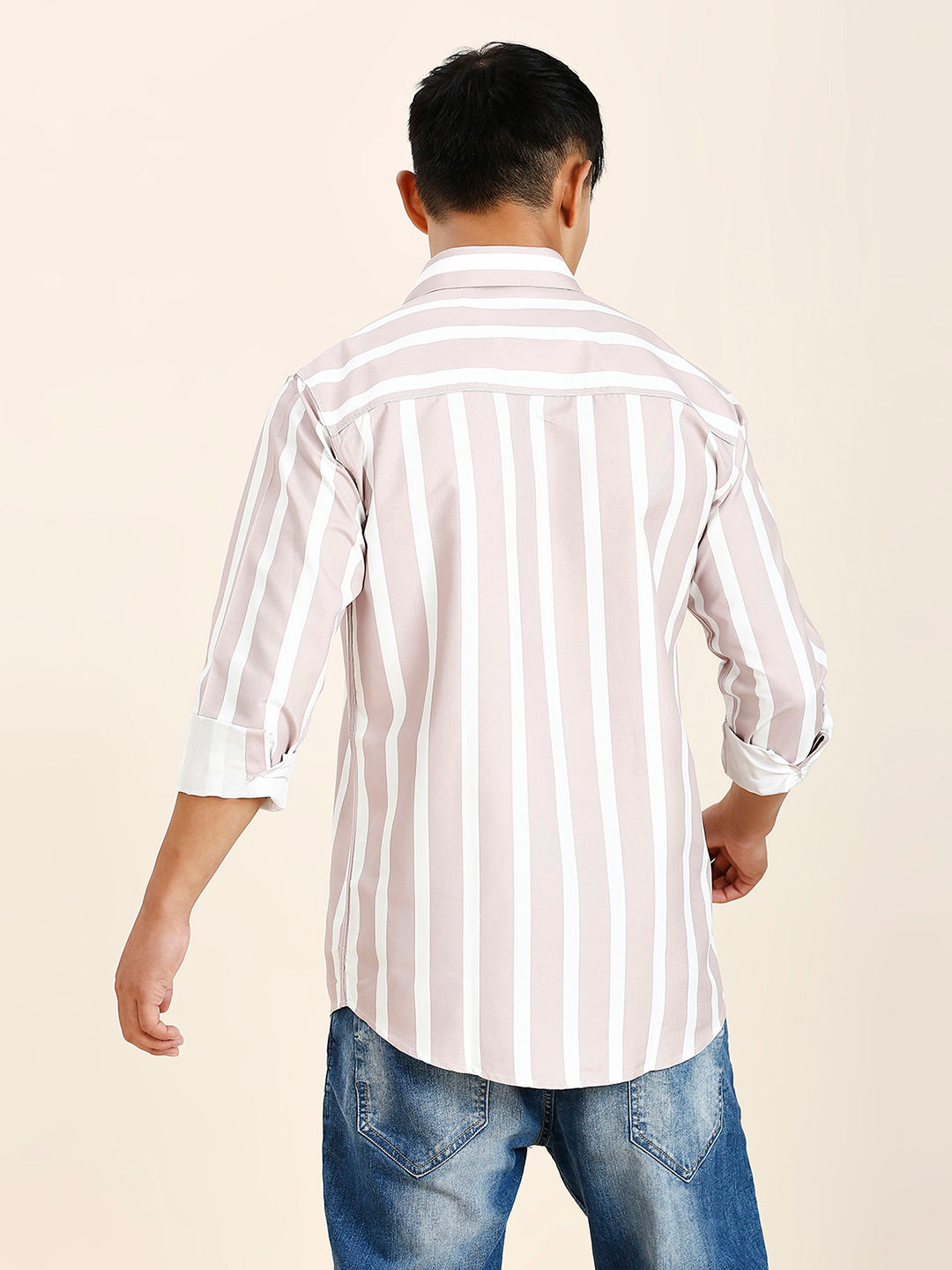 a man wearing a white and black striped shirt