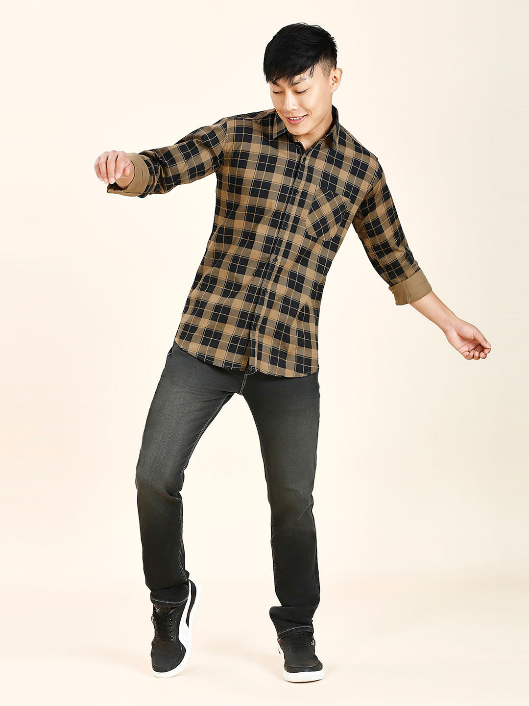 a young man is doing a trick on a skateboard