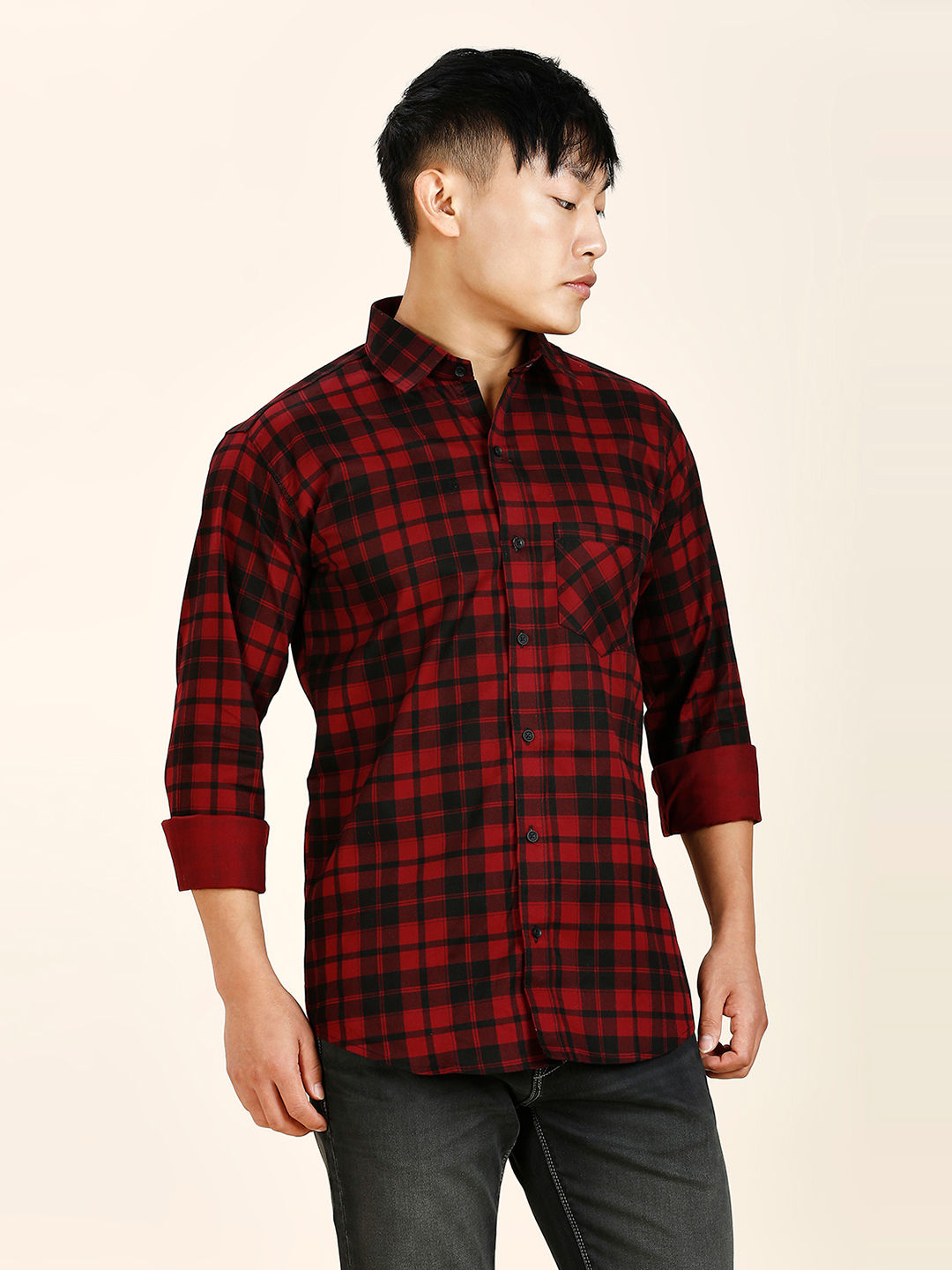 a man in a red and black plaid shirt