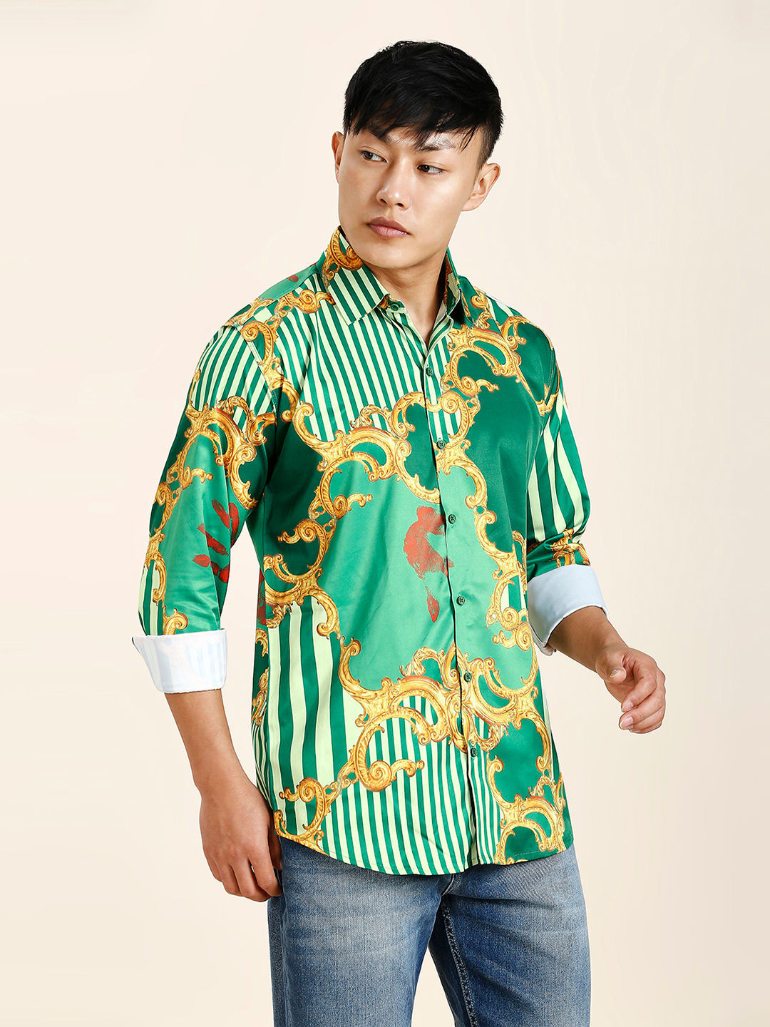 a man wearing a green and gold shirt