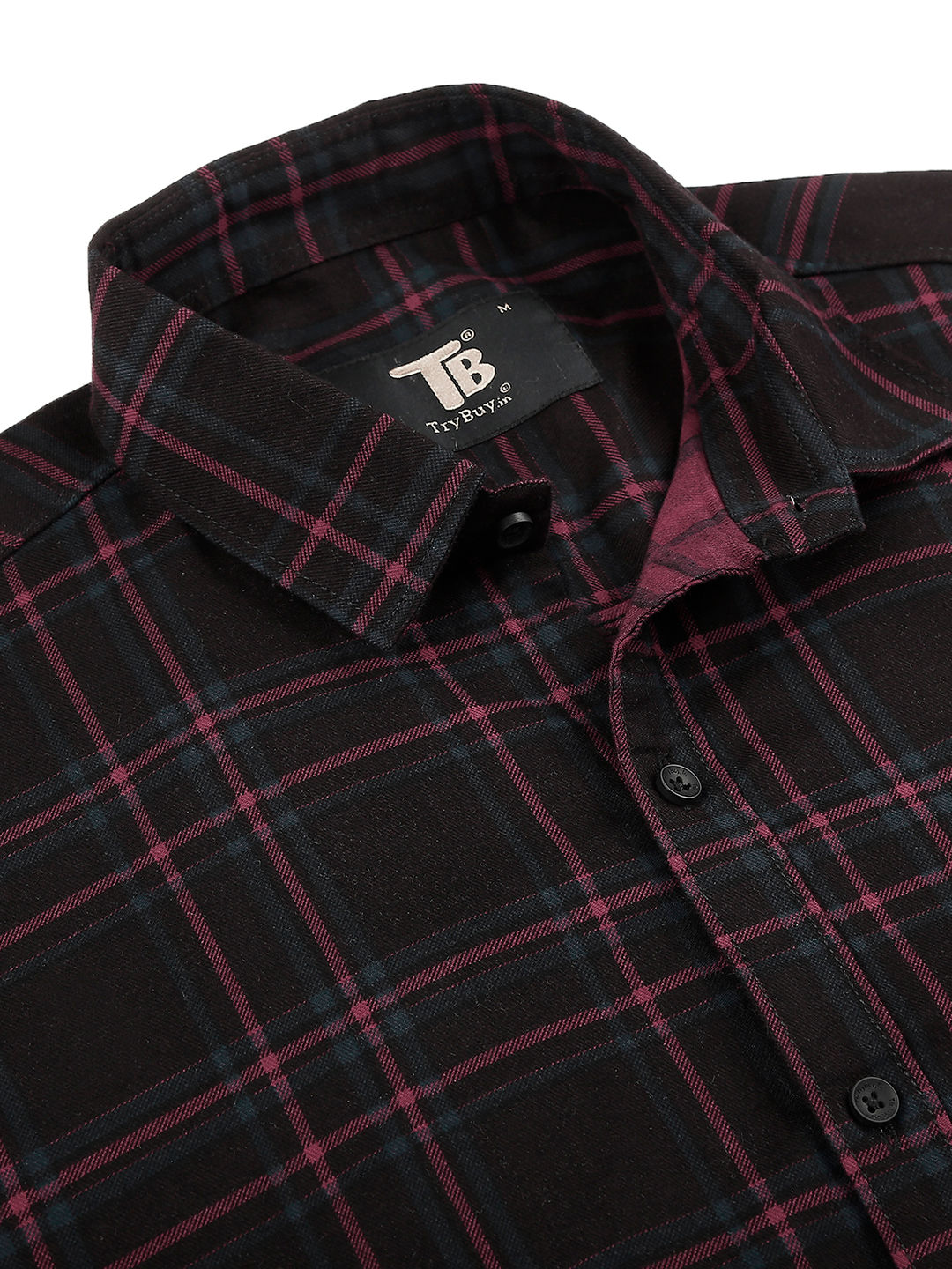 a black and red plaid shirt with a black and white logo