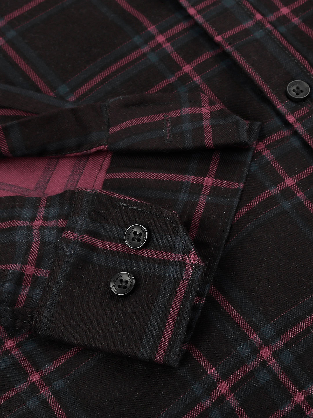 a red and black plaid shirt with a button down collar