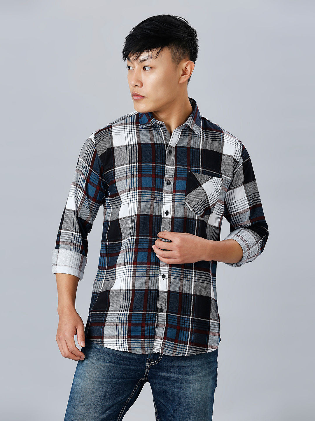 a man in a black and white plaid shirt