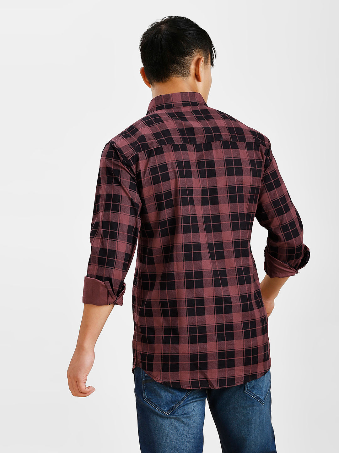 a man wearing a red and black plaid shirt