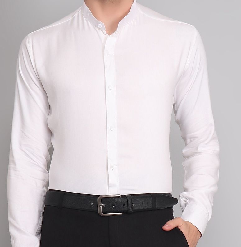 a man wearing a white shirt and black pants