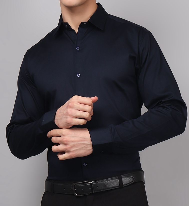 a man wearing a black dress shirt and black pants