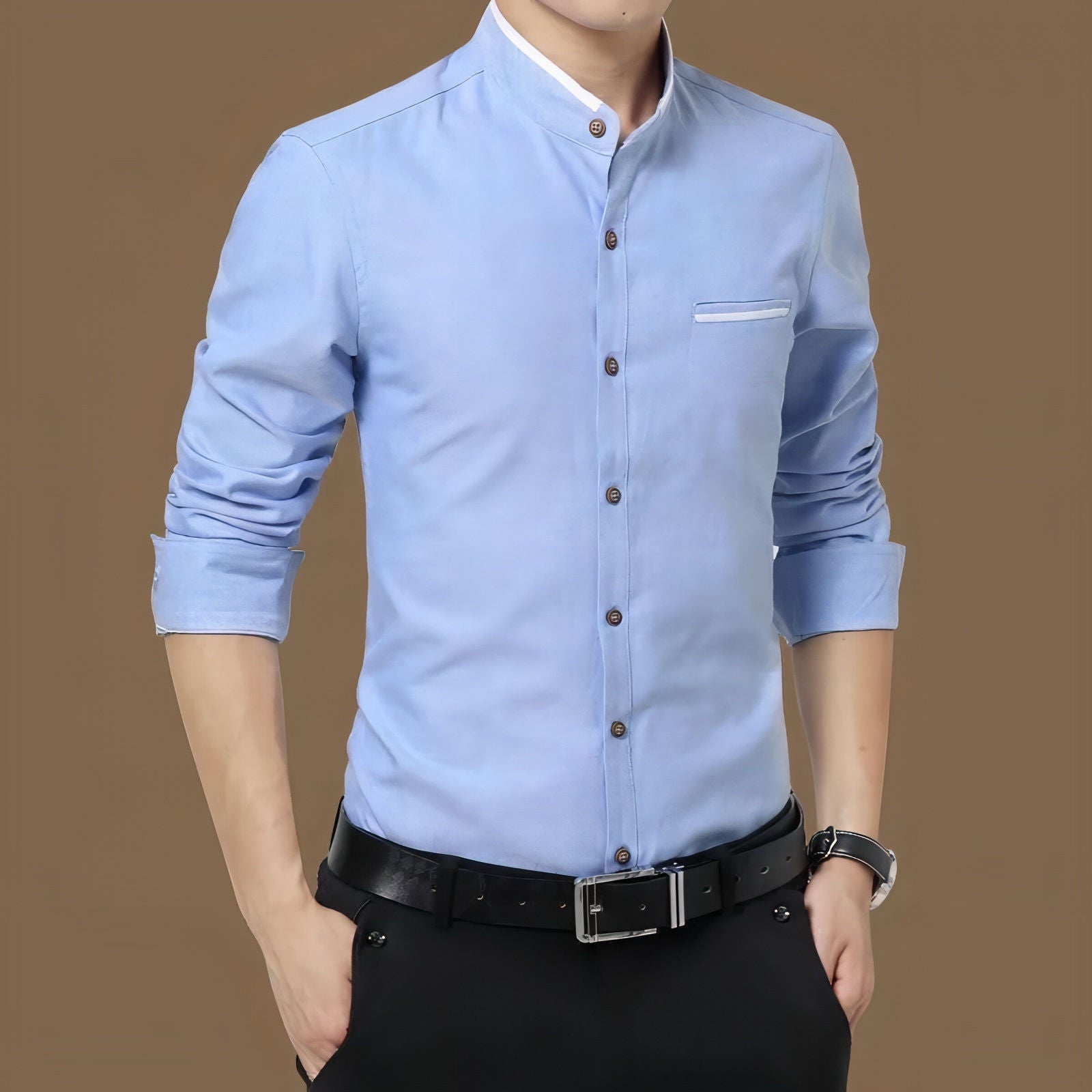 a man wearing a blue shirt and black pants