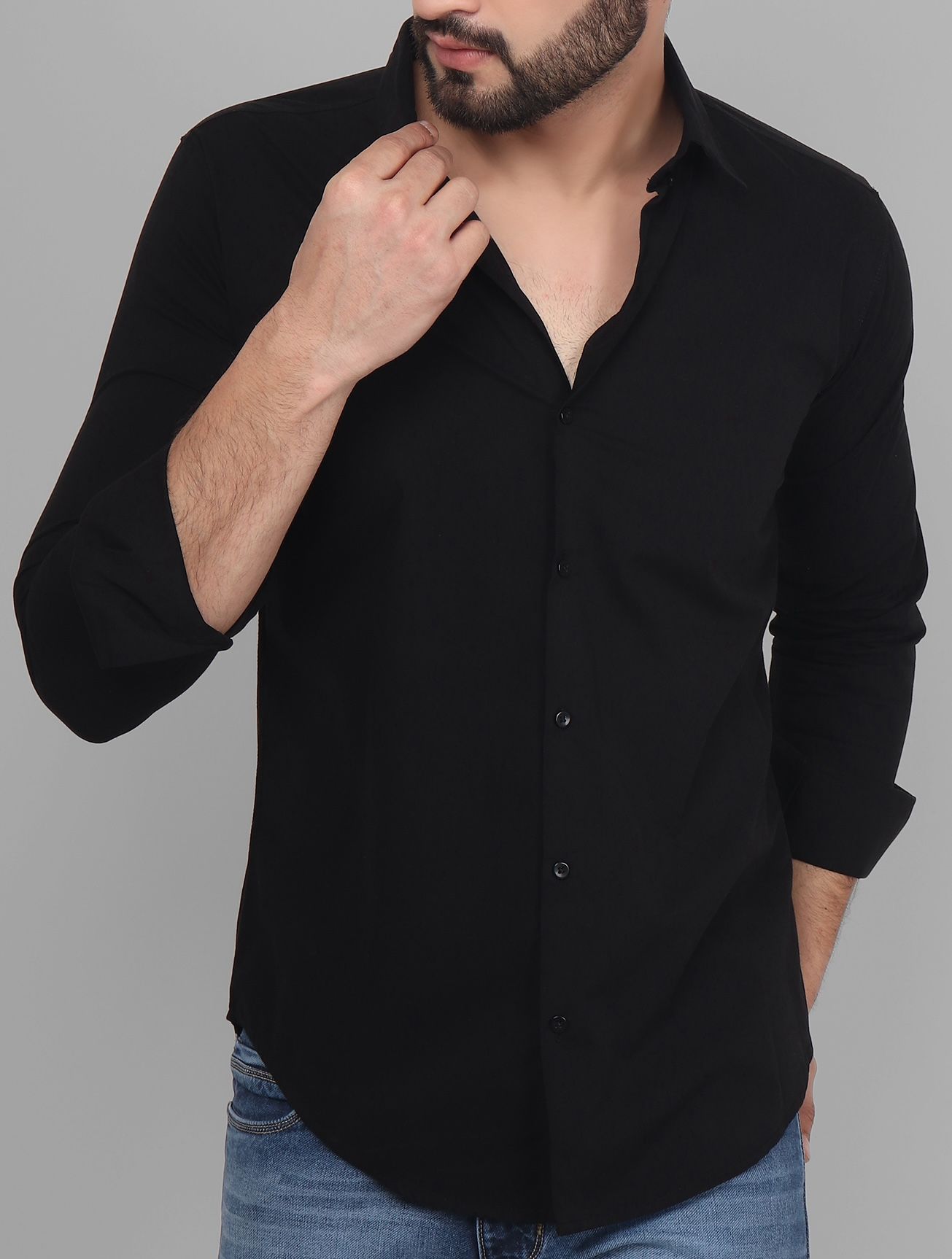 a man wearing a black shirt and jeans