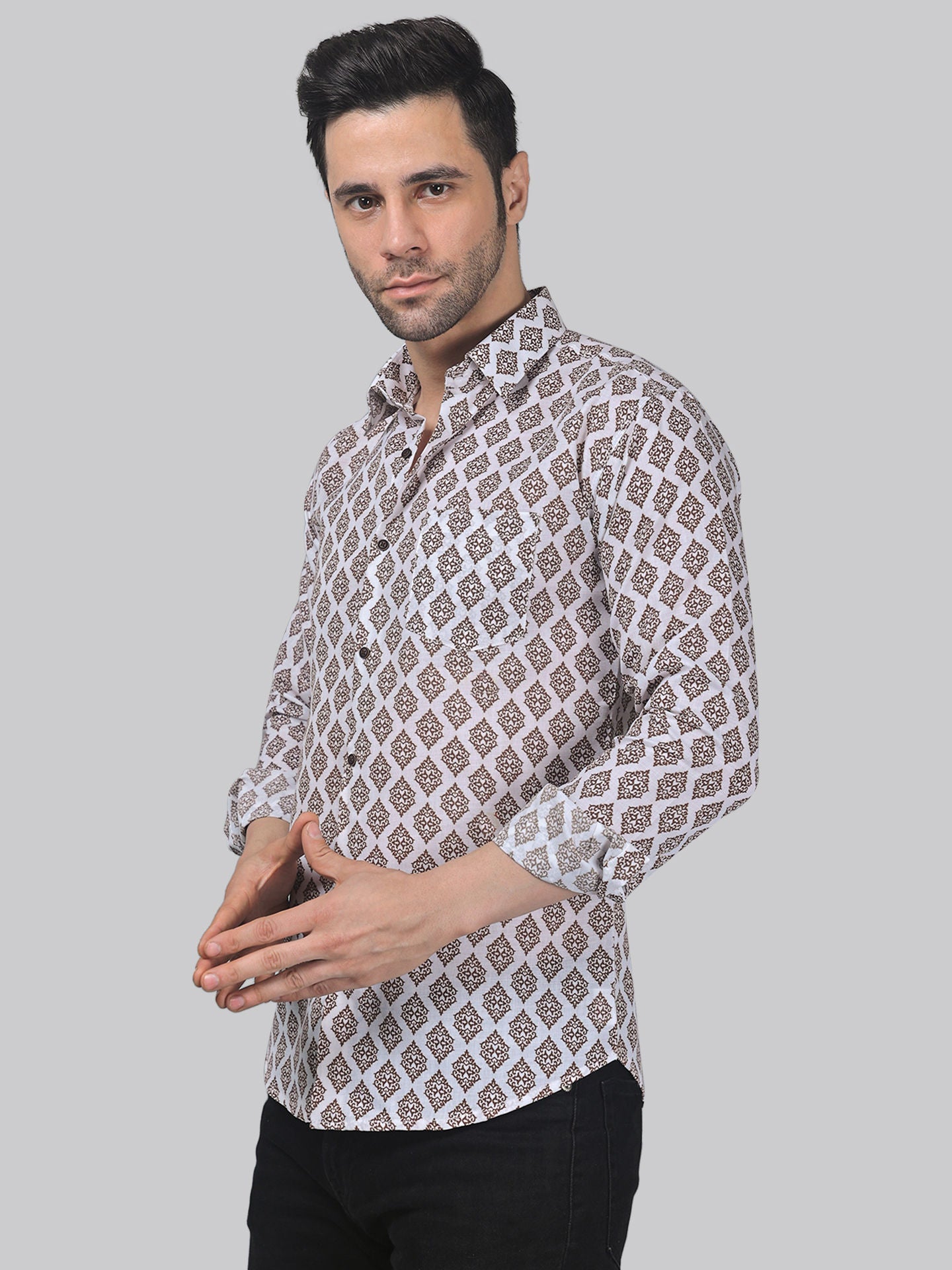 a man wearing a shirt with a pattern on it