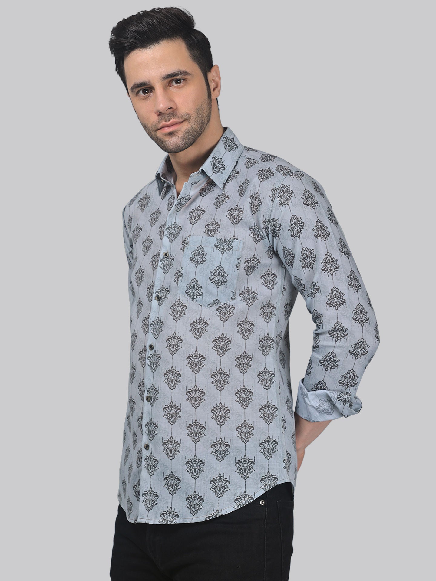 a man wearing a shirt with a pattern on it