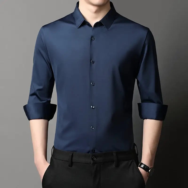 a man wearing a blue shirt and black pants