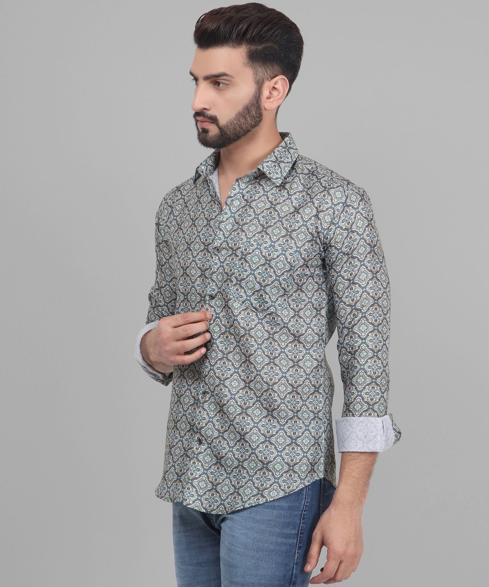 a man with a beard wearing a patterned shirt