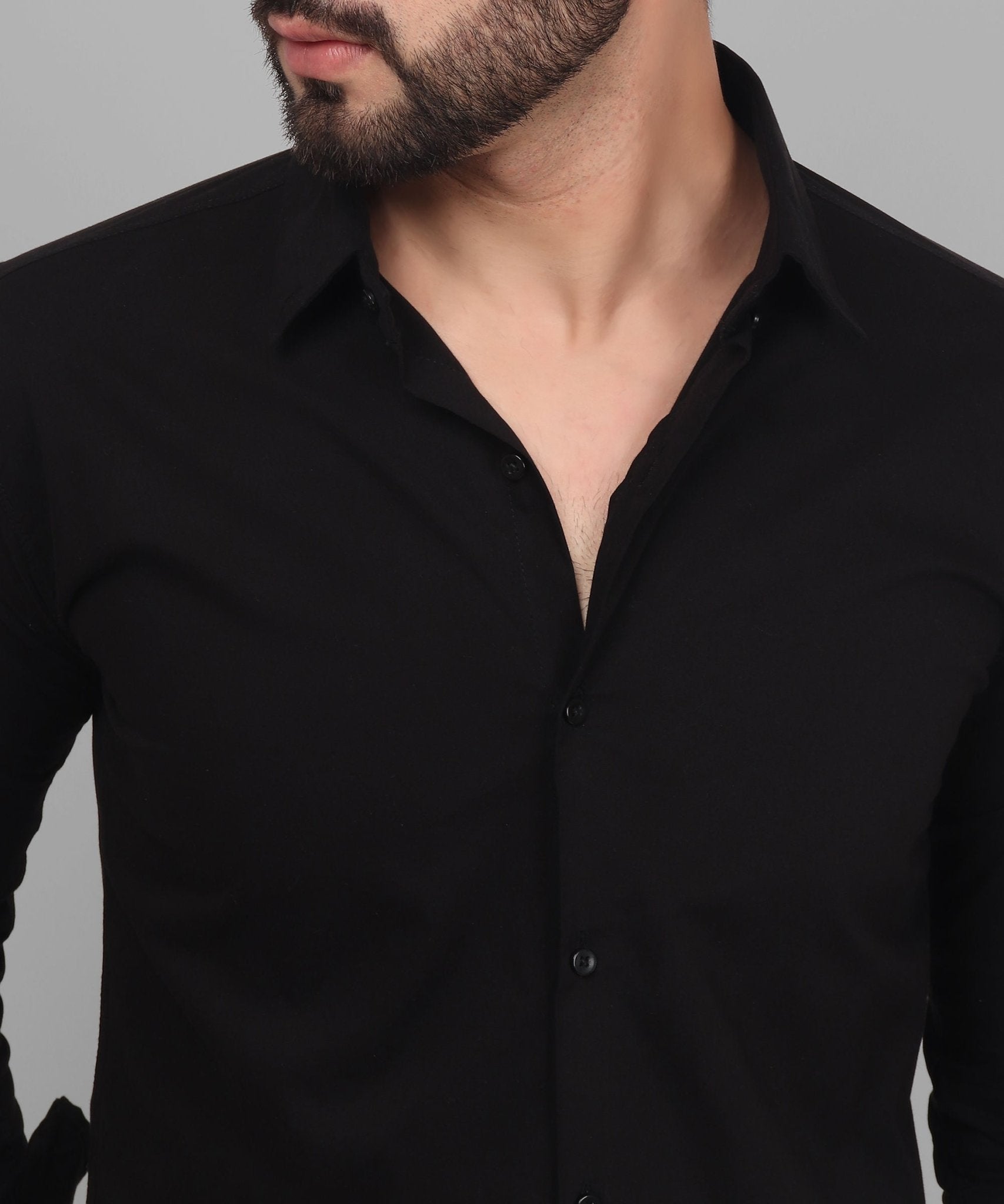 a man with a beard wearing a black shirt