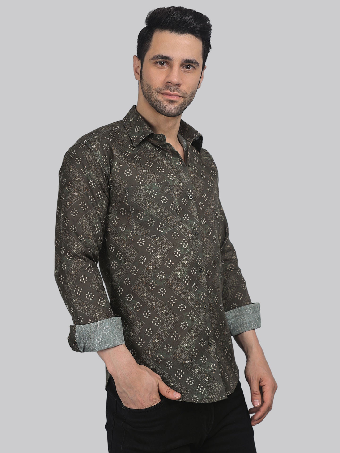 a man wearing a shirt with a pattern on it